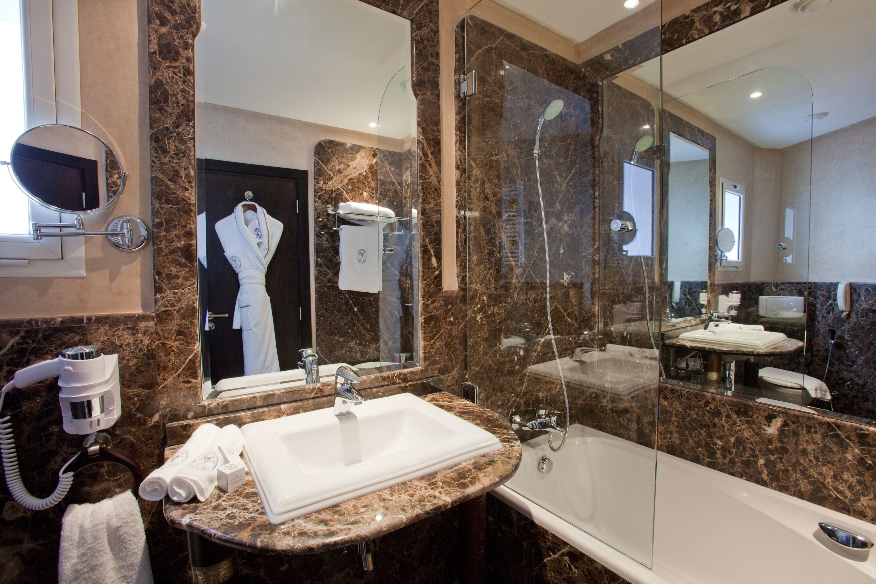 deep-soaking bathtub, rainfall showerhead, designer toiletries