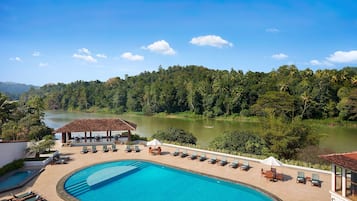 Outdoor pool, open 9:00 AM to 7:00 PM, pool umbrellas, pool loungers