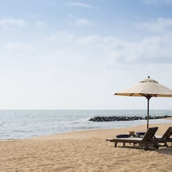On the beach, white sand, beach towels, waterskiing