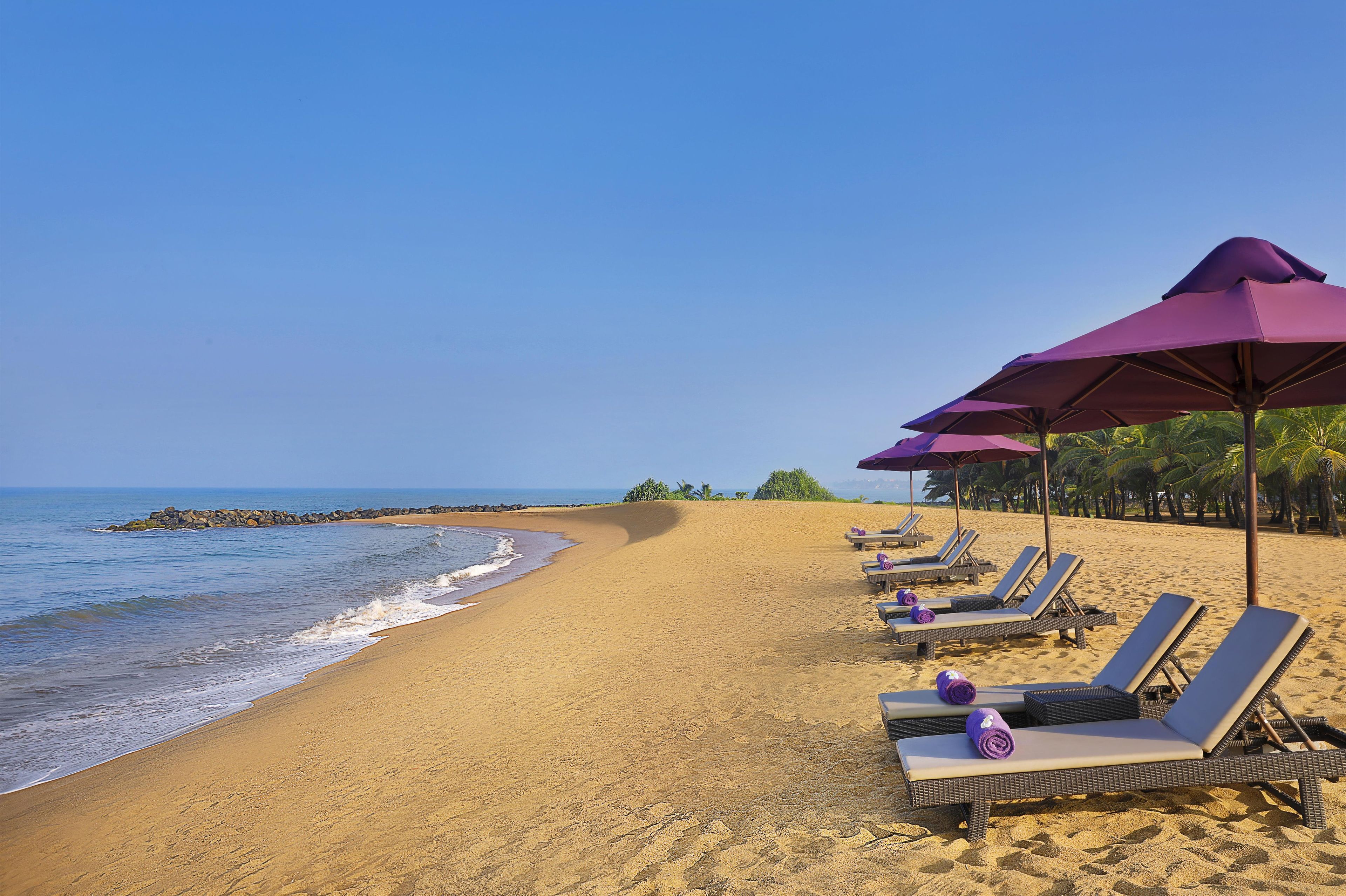 On the beach, white sand, beach towels, water skiing