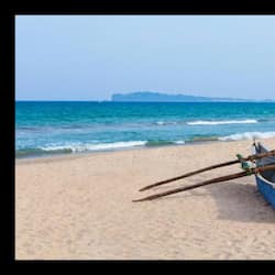 On the beach, white sand, beach umbrellas, beach towels