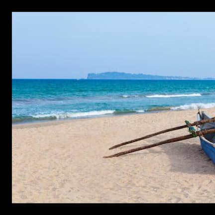 On the beach, white sand, beach umbrellas, beach towels