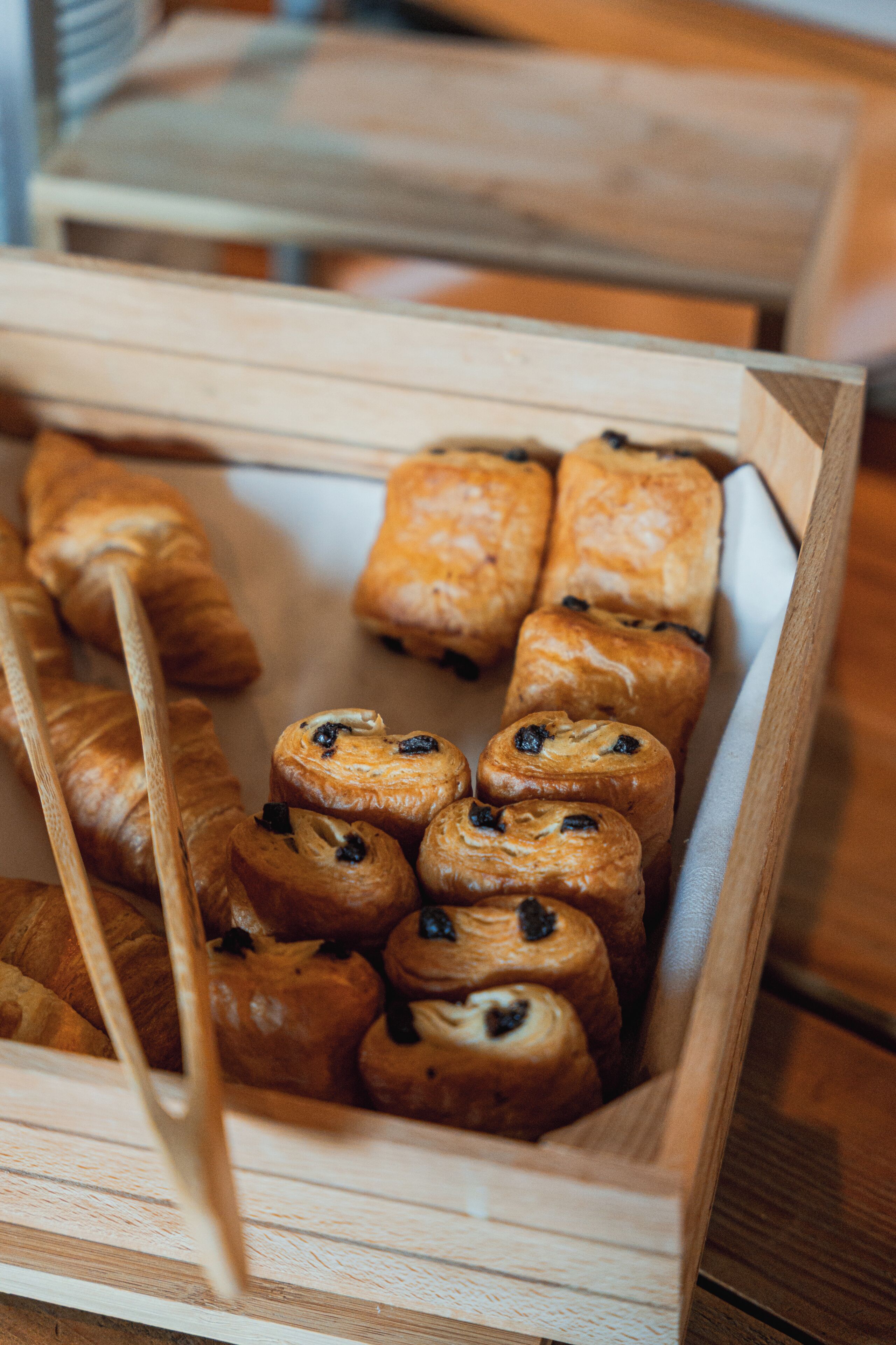 A wooden tray with pastries.