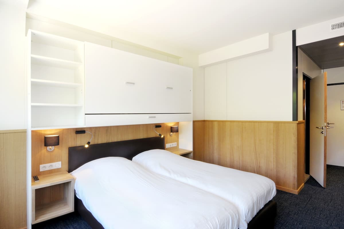 Desk, blackout curtains, free cots/infant beds, free WiFi