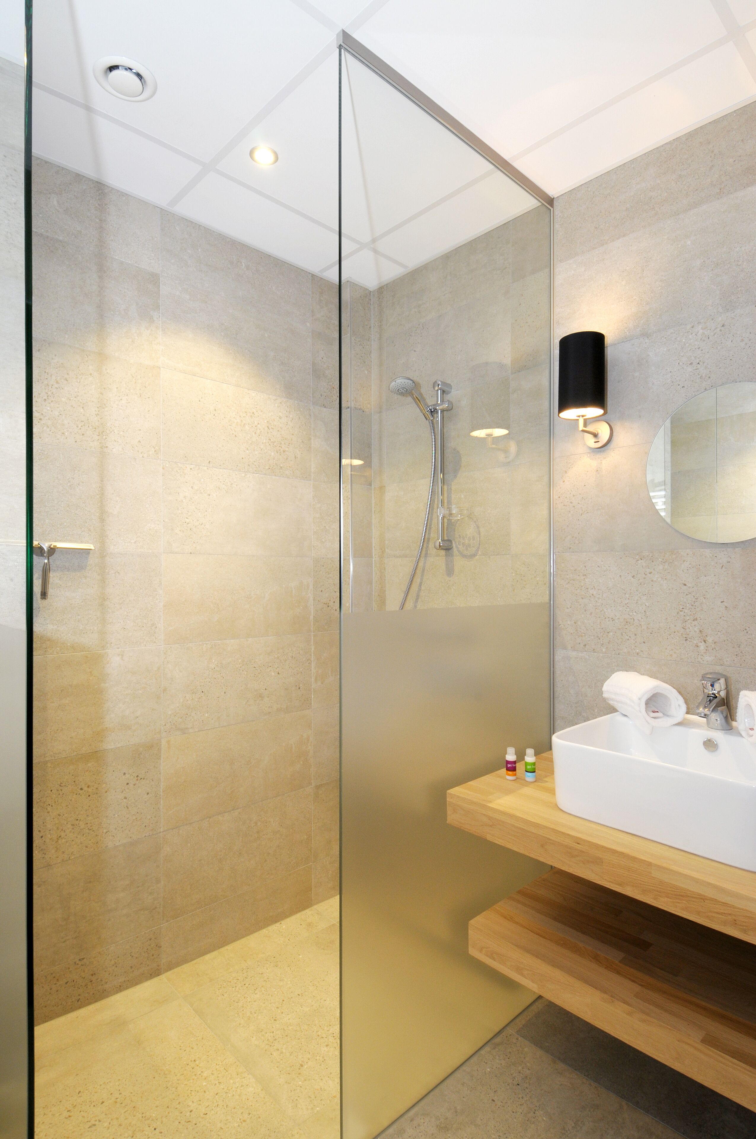 separate bathtub and shower, hair dryer, towels, soap