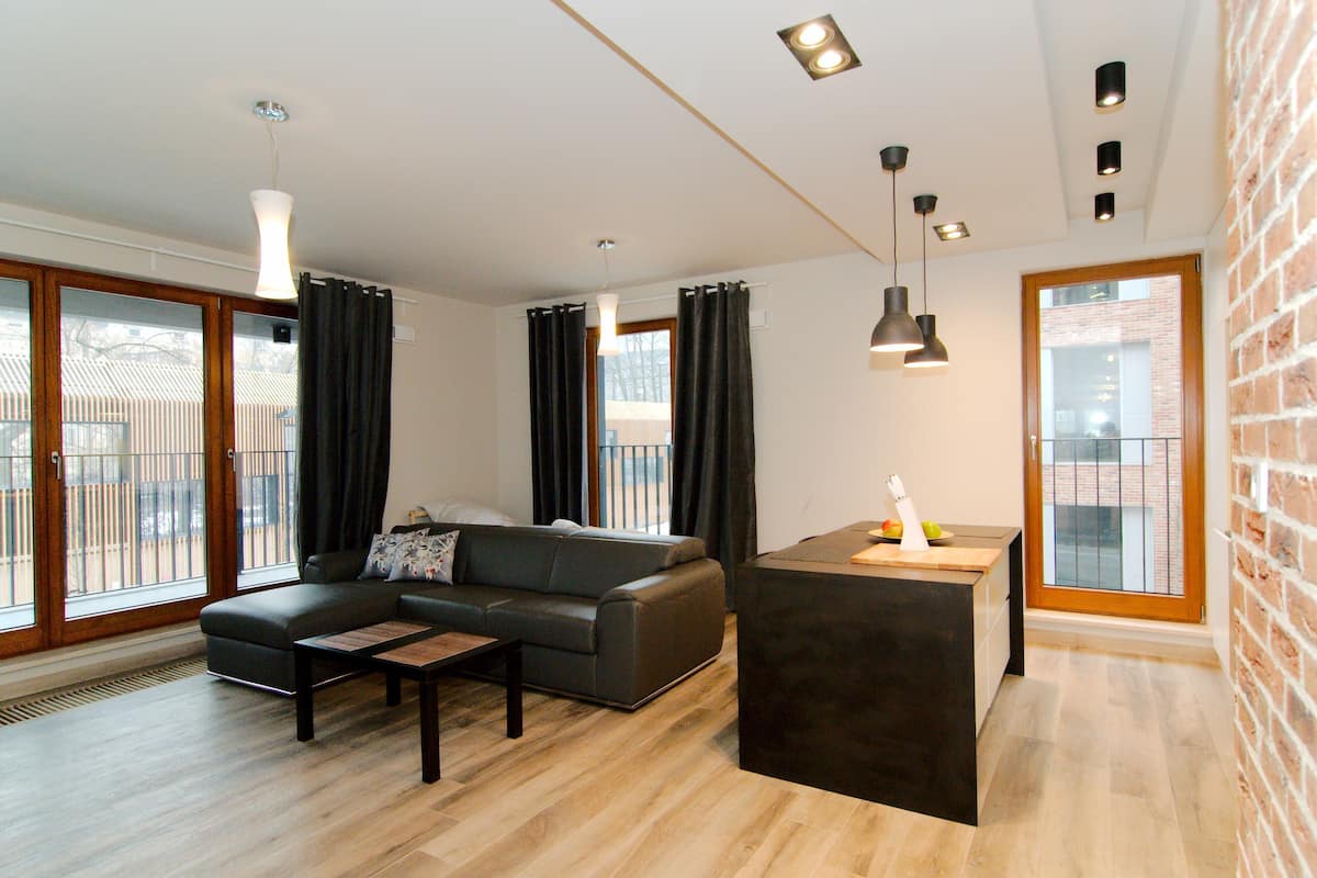 Deluxe Suite, 2 Bedrooms (Lubicz Street) | 1 bedroom, desk, laptop workspace, iron/ironing board