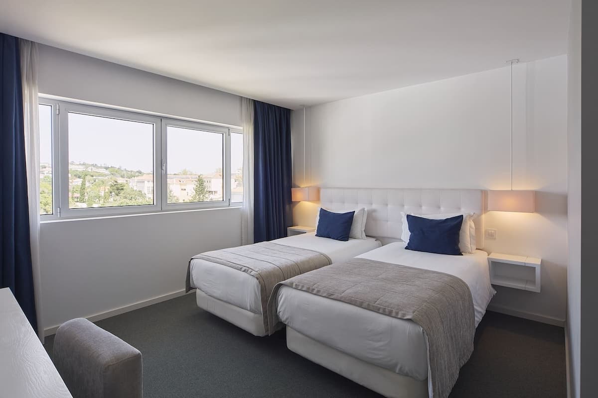 Double or Twin Room (City) | Memory foam beds, minibar, in-room safe, individually decorated