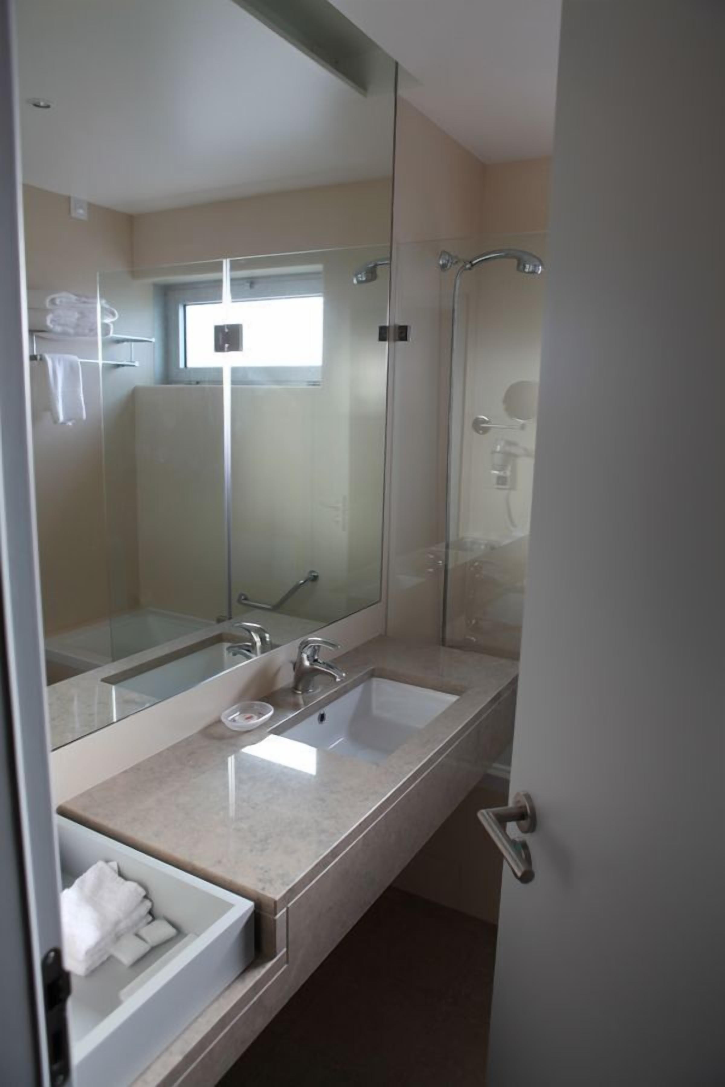 bathtub, free toiletries, hair dryer, towels