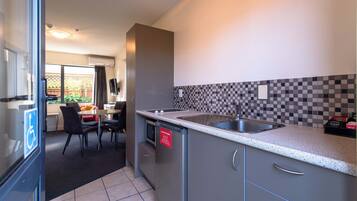 Apartment, 2 Bedrooms | Private kitchen | Fridge, microwave, stovetop, electric kettle