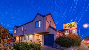 A modern two-story building with a sign for 'Westside Motor Lodge' indicating a vacancy. - 298 Westside Motor Lodge (Christchurch)
