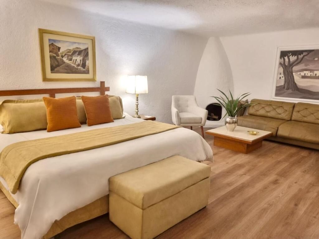 Executive Suite | Down comforters, minibar, in-room safe, individually decorated