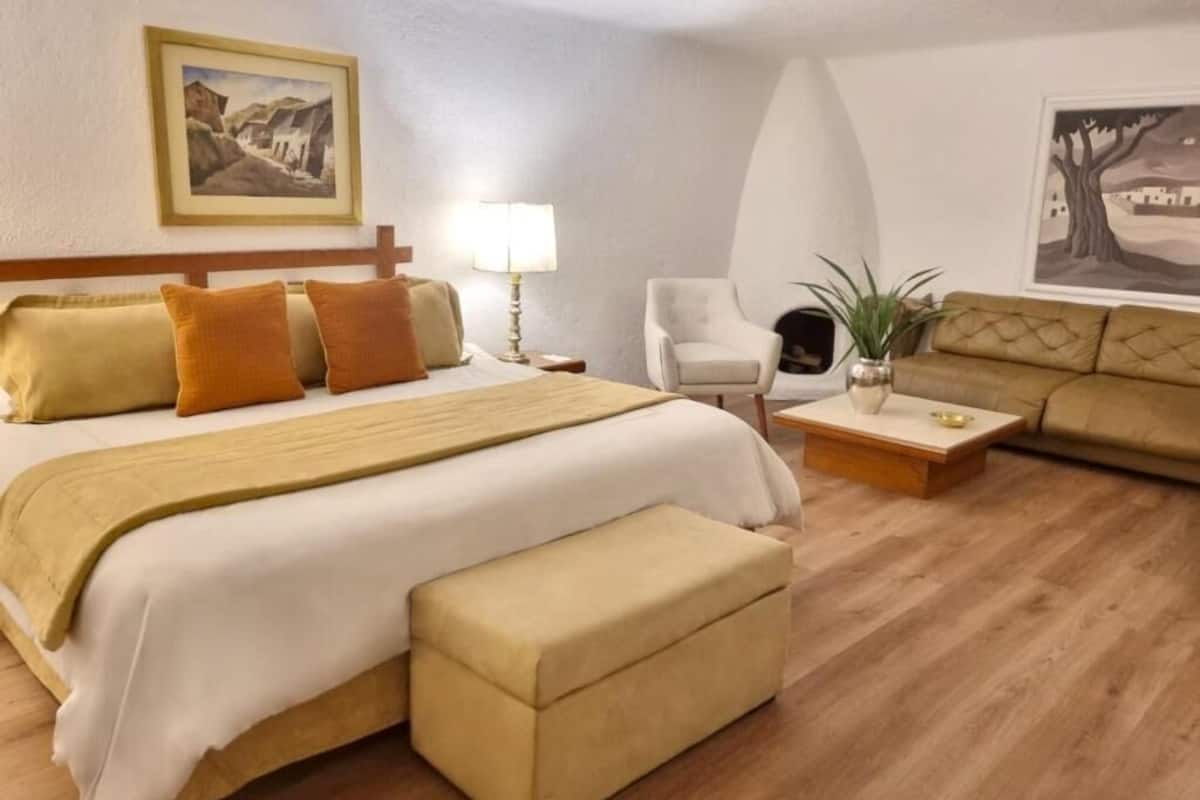 Executive Suite | Down comforters, minibar, in-room safe, individually decorated