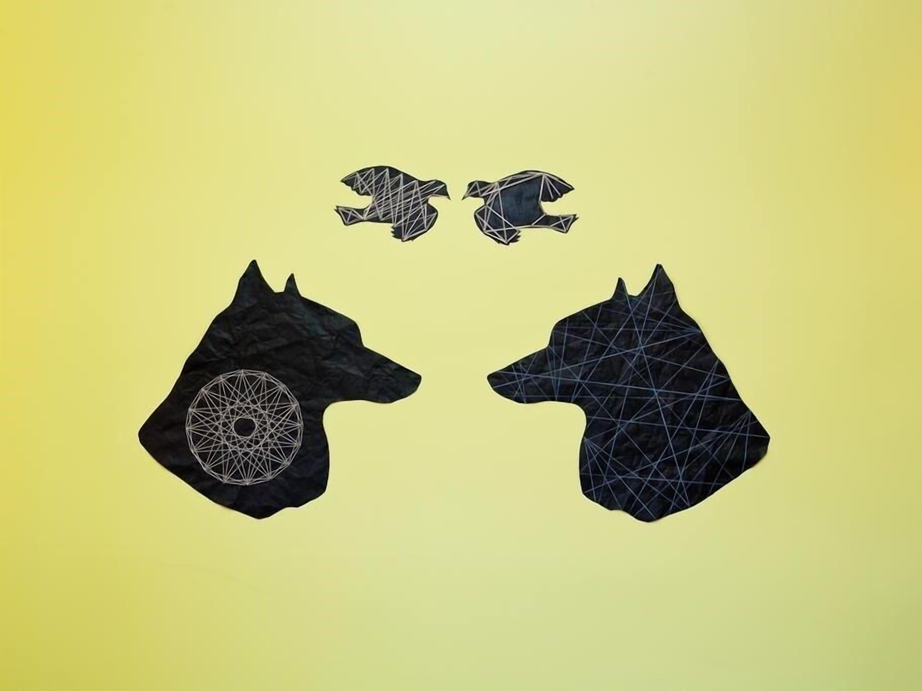 Two black geometric horse-shaped rugs with a circular pattern on one side, set against a yellow background.