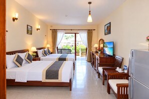 A hotel room with two beds, a dining table, a TV, and a balcony with curtains. - Canary Beach Resort (Mui Ne)