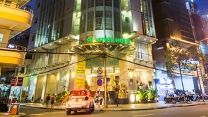 A hotel with a modern design, featuring a prominent entrance and signage. - Sun River Hotel (Da Nang)