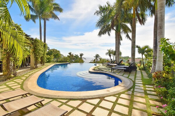 Outdoor pool, open 8:00 AM to 10:00 PM, sun loungers, lifeguards on site