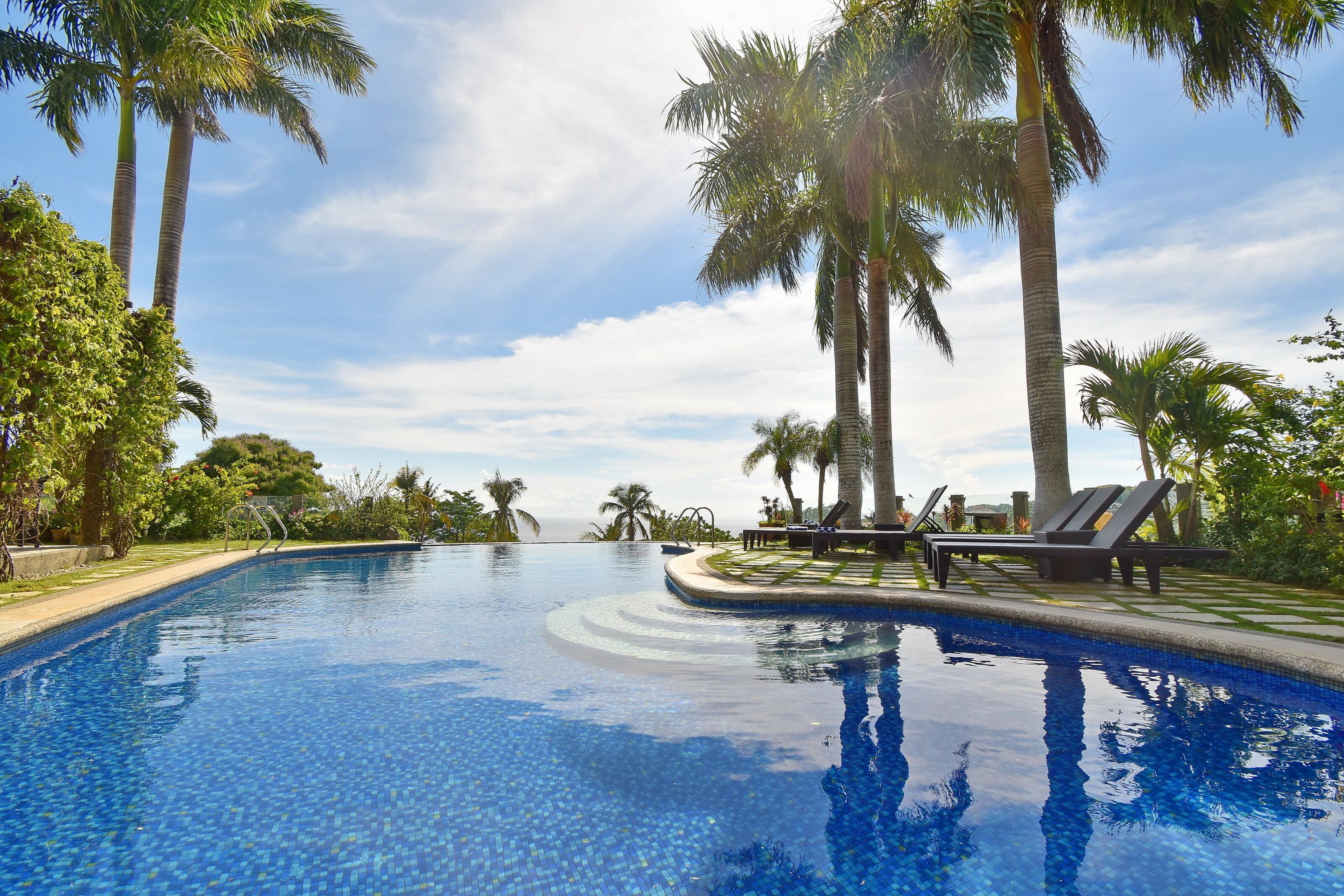 Outdoor pool, open 8:00 AM to 10:00 PM, sun loungers, lifeguards on site