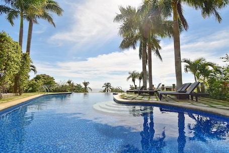 Outdoor pool, open 8:00 AM to 10:00 PM, sun loungers, lifeguards on site