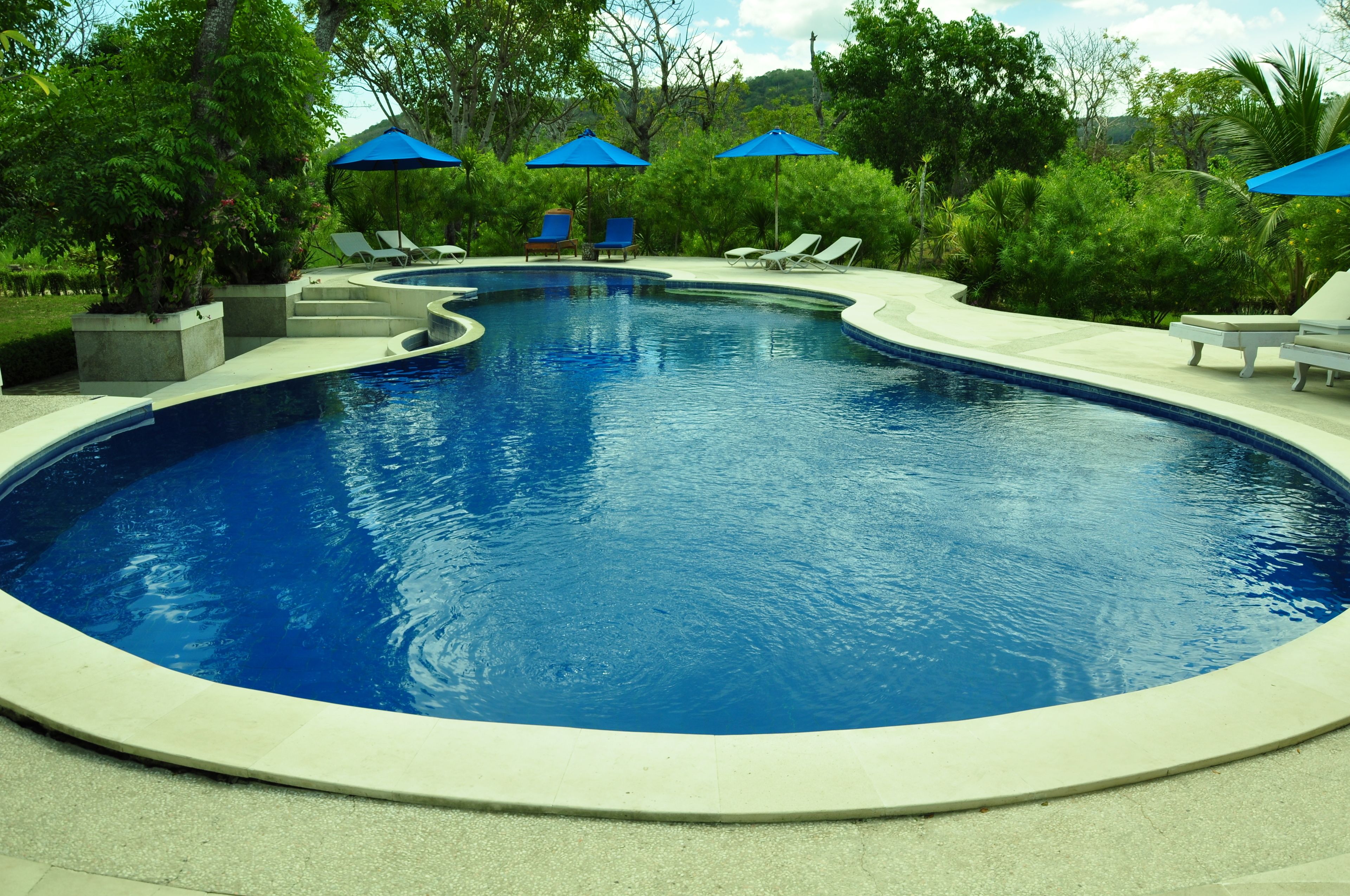 outdoor pool, open 7:30 am to 7:00 pm, pool umbrellas, pool loungers