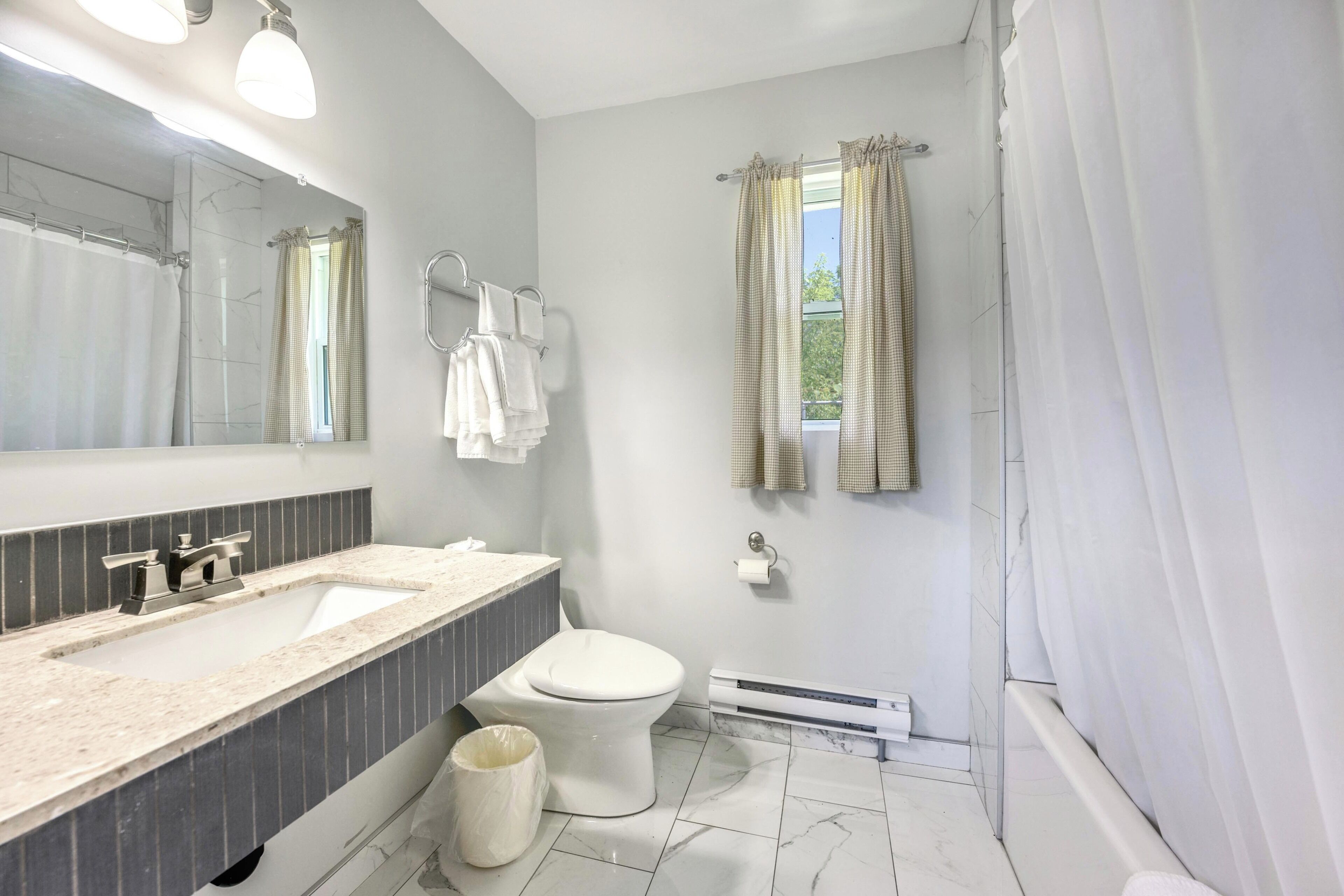 Combined shower/bathtub, deep-soaking bathtub, rainfall showerhead