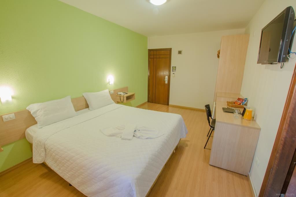 double or twin room | minibar, in-room safe, desk, laptop workspace