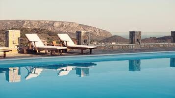 Outdoor pool, open 9:00 AM to 7:00 PM, pool umbrellas, pool loungers