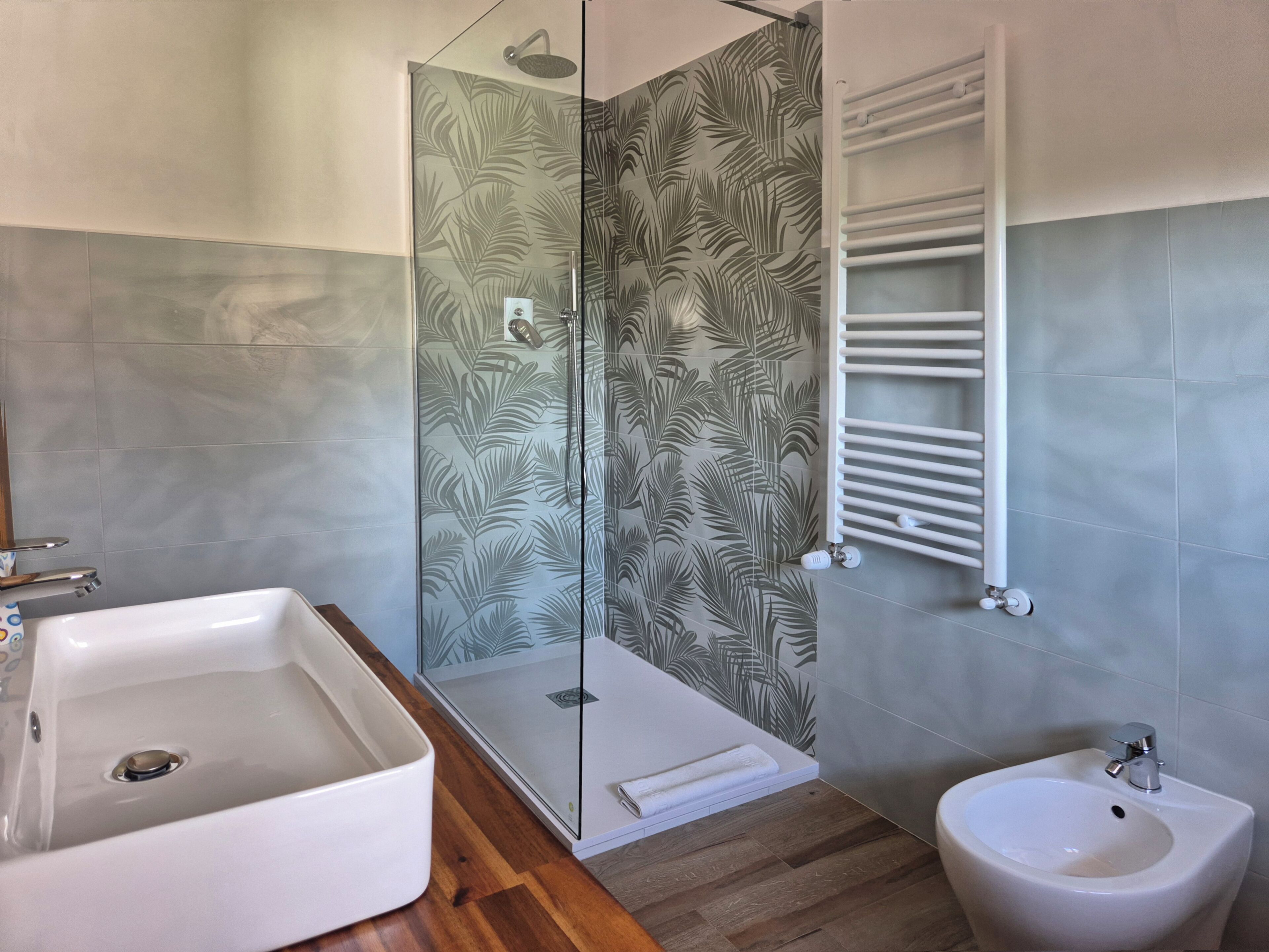 Shower, rainfall showerhead, hair dryer, towels