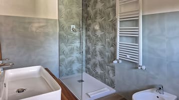 Shower, rainfall showerhead, hair dryer, towels