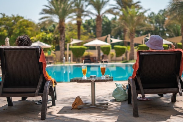 Outdoor pool, open 7:00 AM to 9:00 PM, pool umbrellas, pool loungers