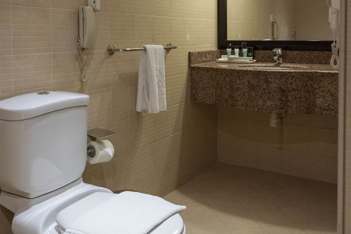 separate bathtub and shower, rainfall showerhead, designer toiletries