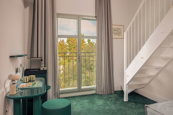 Habitació triple Deluxe | Roba de llit d'alta qualitat i matalassos amb encoixinament addicional