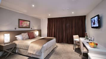 Deluxe Studio | Premium bedding, pillow-top beds, in-room safe, blackout curtains