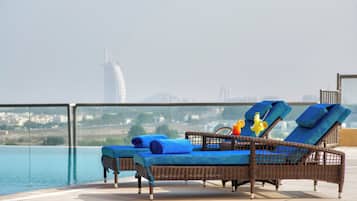 Outdoor pool, open 8:00 AM to 10:30 PM, pool loungers