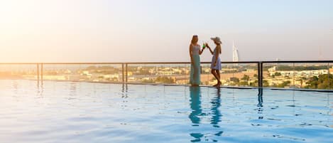 Outdoor pool, open 8:00 AM to 10:30 PM, pool loungers