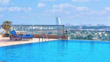 Outdoor pool, open 8:00 AM to 10:30 PM, sun loungers