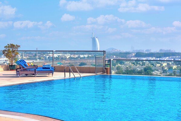 Outdoor pool, open 8:00 AM to 10:30 PM, pool loungers