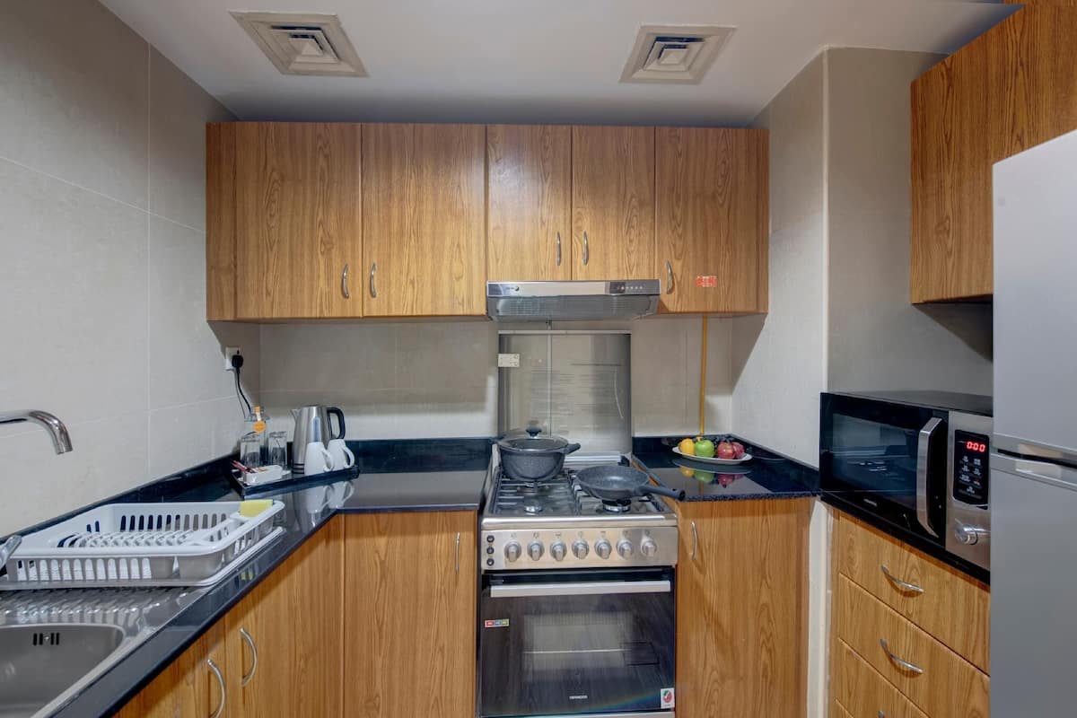 One Bedroom Apartment City View | Private kitchen | Full-size fridge, electric kettle, paper towels