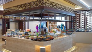 A buffet setup with various food items and decorative elements. - Two Seasons Hotel & Apartments (Dubai)