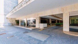 The exterior of Hotel Panamericano with a modern design, featuring a large entrance, a number '778' sign, and a clean, paved ground area. - Hotel Pan Americano (São Paulo)