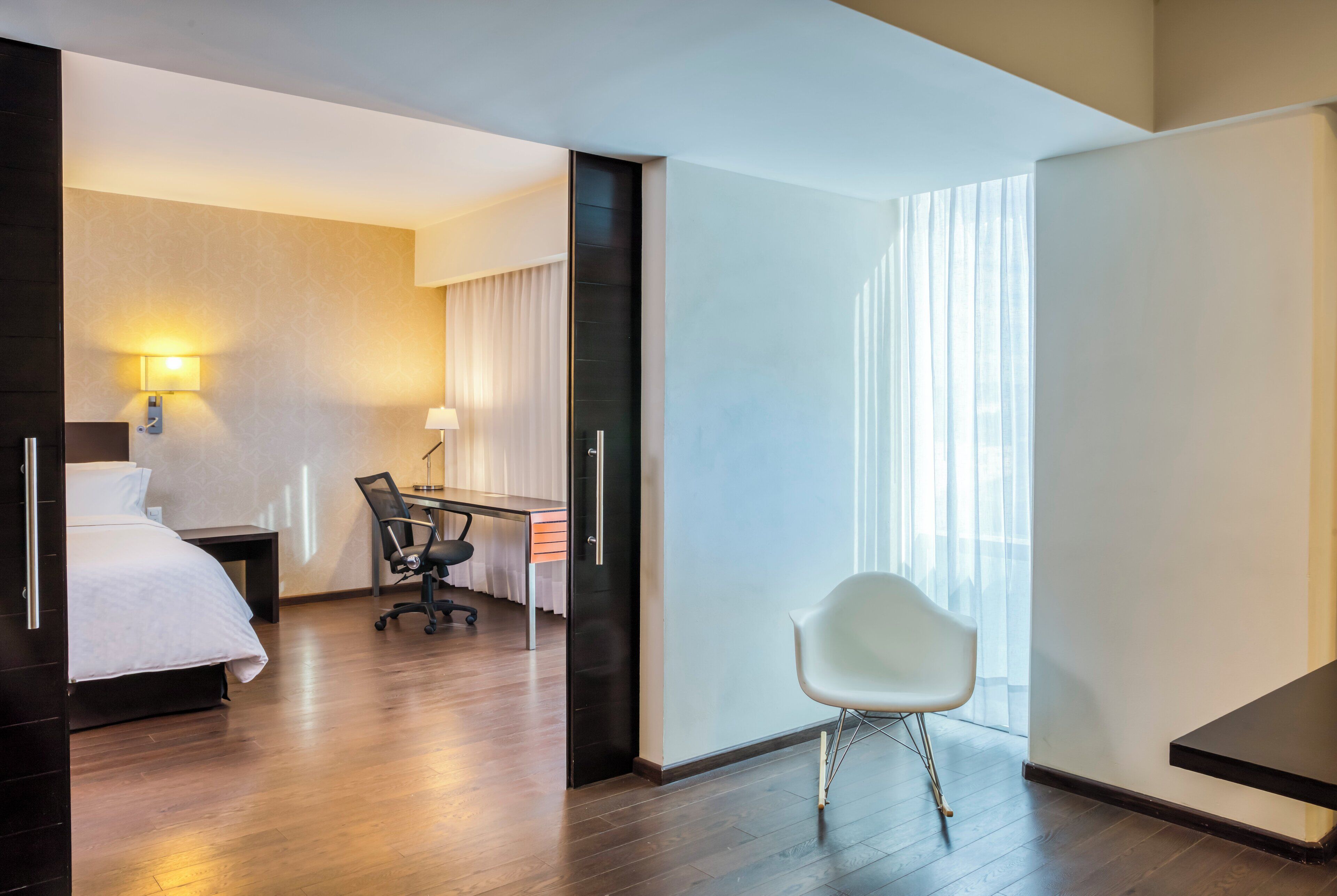 junior suite | in-room safe, desk, laptop workspace, iron/ironing board