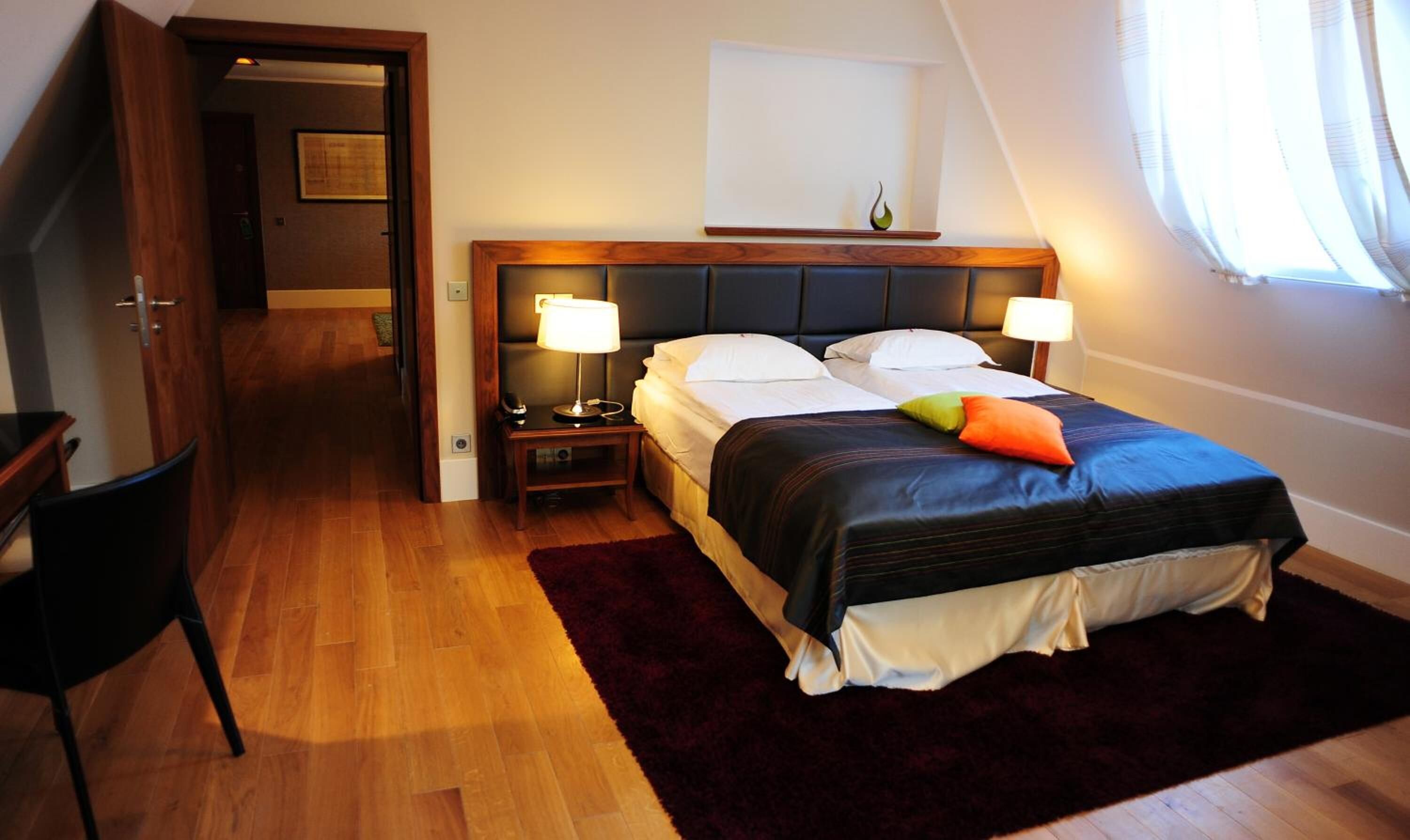 minibar, desk, blackout curtains, iron/ironing board