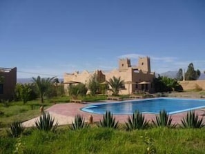Seasonal outdoor pool, pool umbrellas, pool loungers