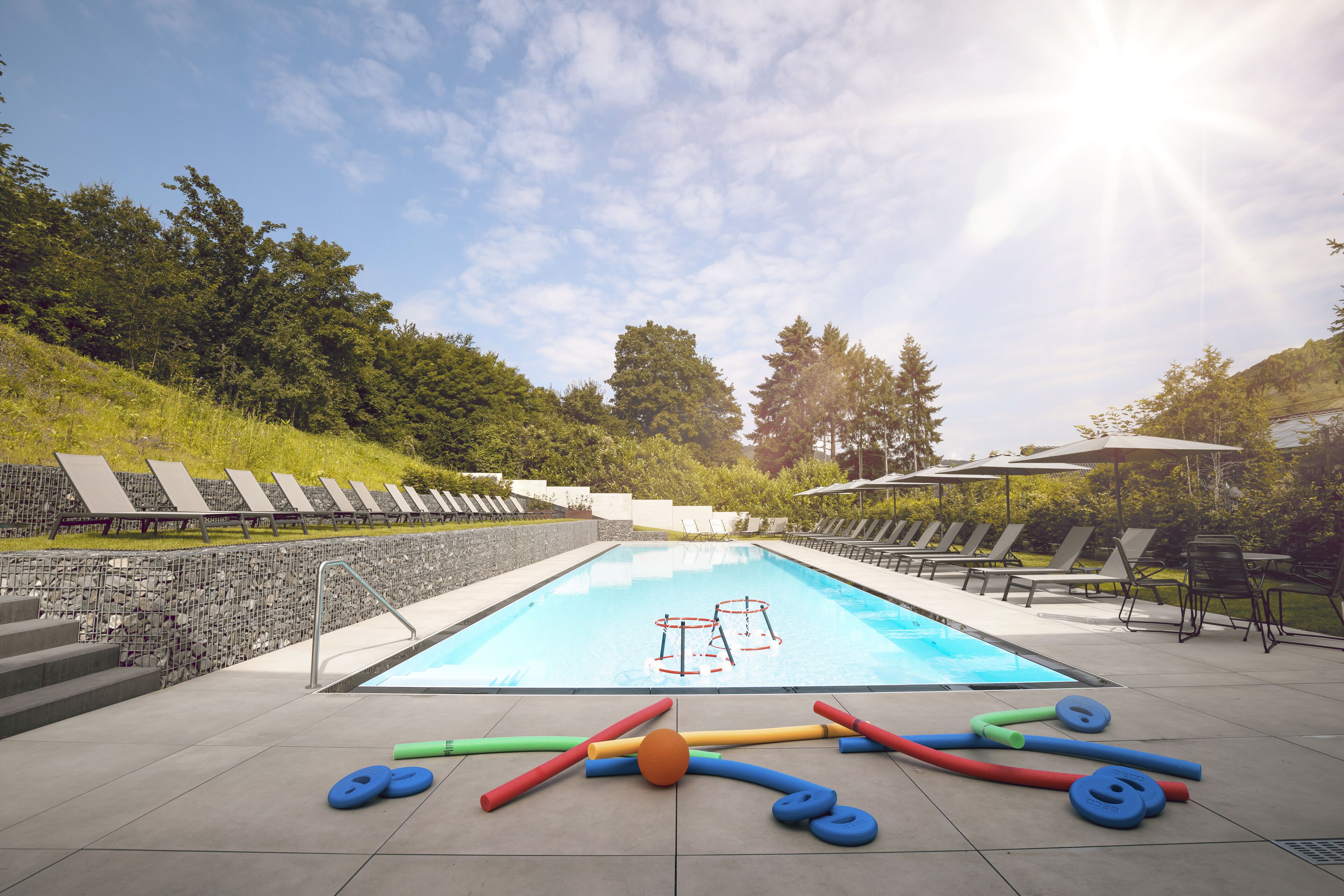outdoor pool, pool umbrellas, pool loungers