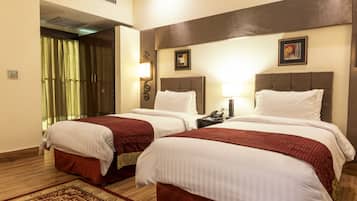Deluxe Twin Room, 2 Twin Beds, Private Bathroom | Minibar, in-room safe, desk, blackout drapes