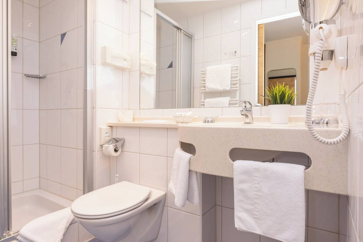 superior double room, balcony | bathroom | rainfall showerhead, hair dryer, bathrobes, slippers