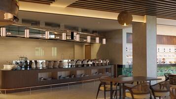 Una cocina moderna con una encimera amplia que exhibe diverso menaje, una zona de comedor con una mesa y sillas, y un ventanal grande que proporciona luz natural.