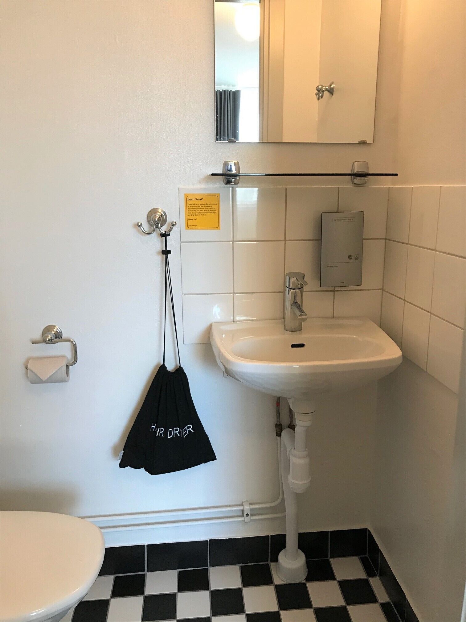 economy room, shared bathroom | bathroom | hair dryer, towels, soap, shampoo