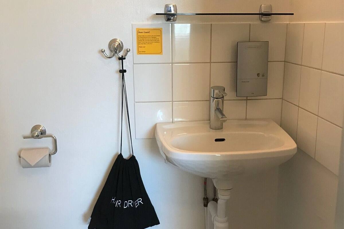 economy room, shared bathroom | bathroom | hair dryer, towels, soap, shampoo