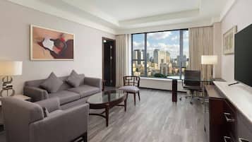 Executive Suite, 1 King Bed | Living room | 42-inch LCD TV with satellite channels, TV, iPod dock