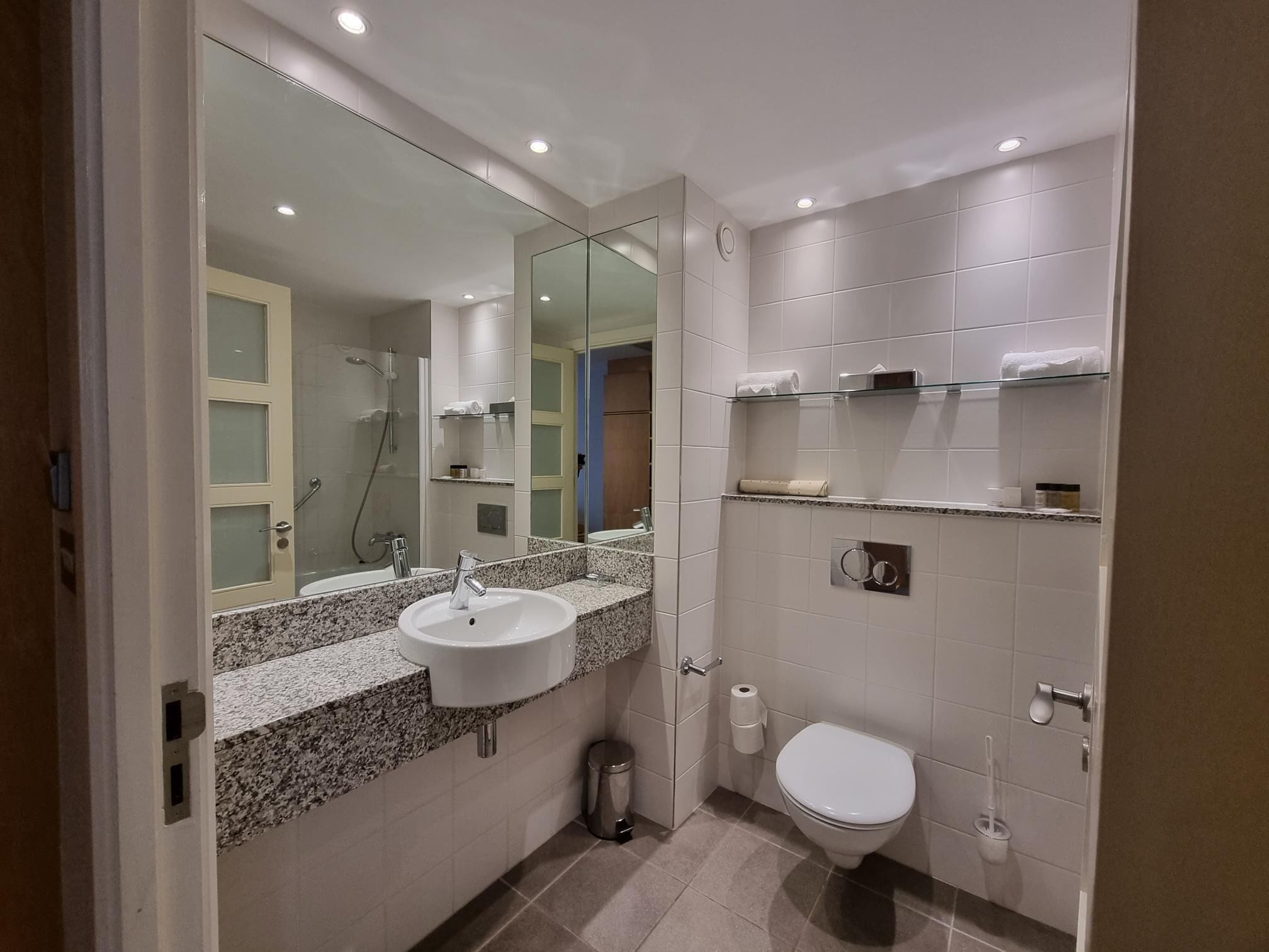 separate bathtub and shower, hair dryer, towels